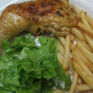 a piece of chicken with fries and lettuce