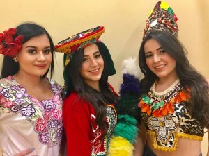 3 ladies in different Peruvian cultural clothing